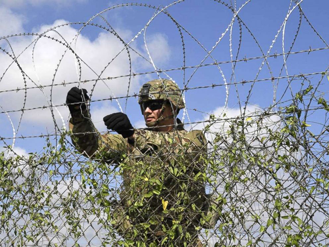 Razor wire assembled into a military protective fence